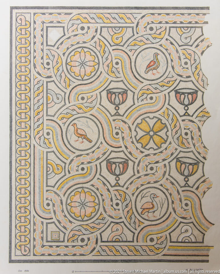 Rectangular polychrome mosaic panel with birds, floral rosettes, vessels, scrollwork, and interlaced geometric borders.