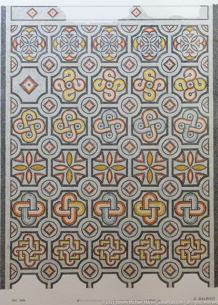 Polychrome mosaic composed of horizontal rows of interlace knots, floral motifs, diamonds, and small geometric borders.