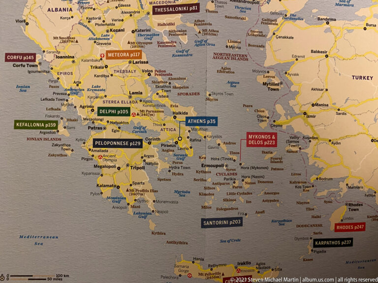 Printed map of Greece with Thessaloniki highlighted among other destinations and regional labels.