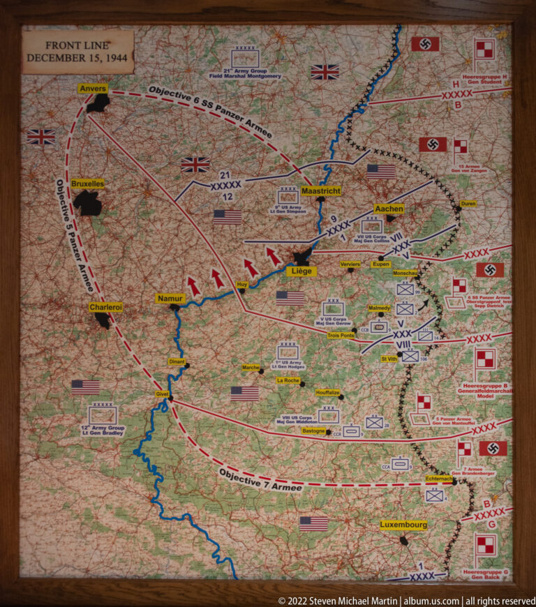 Large military operations map centered on Bastogne with colored front lines, arrows, unit symbols, and town names.