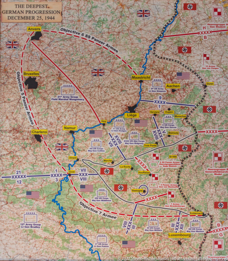 Detailed Bastogne-area military map with red and blue arrows, unit symbols, front lines, and surrounding towns.