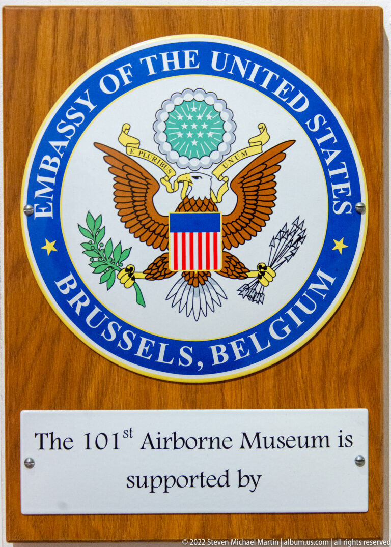Great Seal of the United States plaque for the U.S. Embassy in Brussels above a museum-support statement.