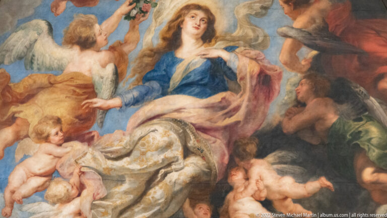 Close detail of Mary in blue rising among angels from Rubens’s Assumption of the Virgin.