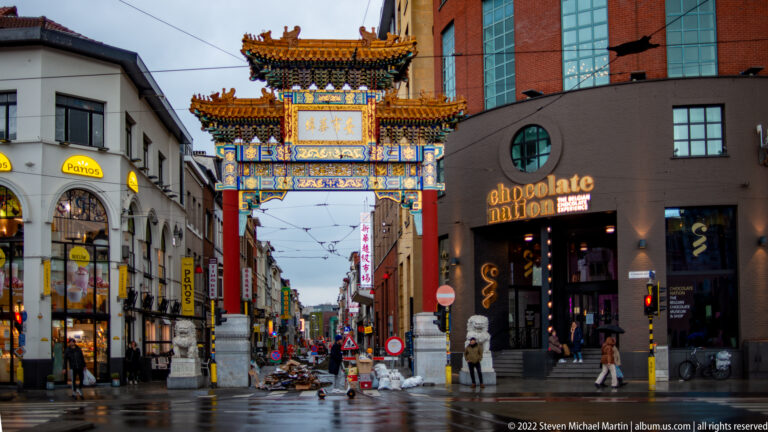 Colorful Chinese gateway spanning Van Wesenbekestraat at the entrance to Antwerp’s Chinatown.