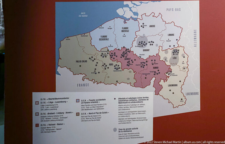 Map of Belgium divided by province with colored areas and many plotted political or organizational symbols.