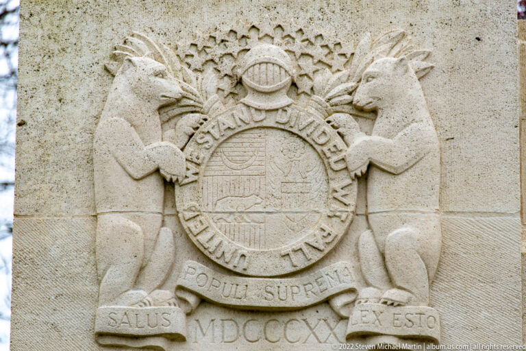 Stone relief of Missouri's seal with two bears, stars, motto ribbons, and MDCCCXX.
