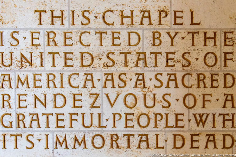 Large carved inscription in capital letters dedicating the chapel as a sacred rendezvous with the immortal dead.