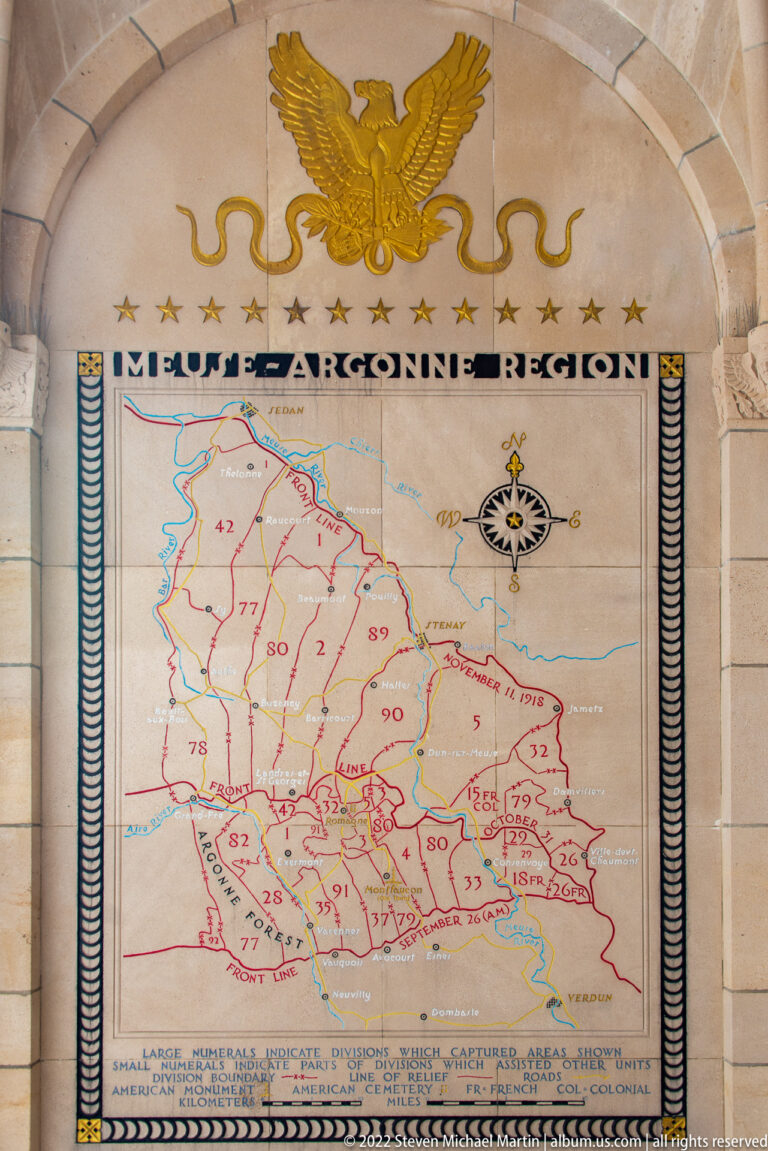 Large Meuse-Argonne campaign map with red lines and unit numbers beneath a gilded American eagle.