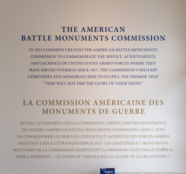 Bilingual English and French wall text explaining the American Battle Monuments Commission and its 1923 creation.