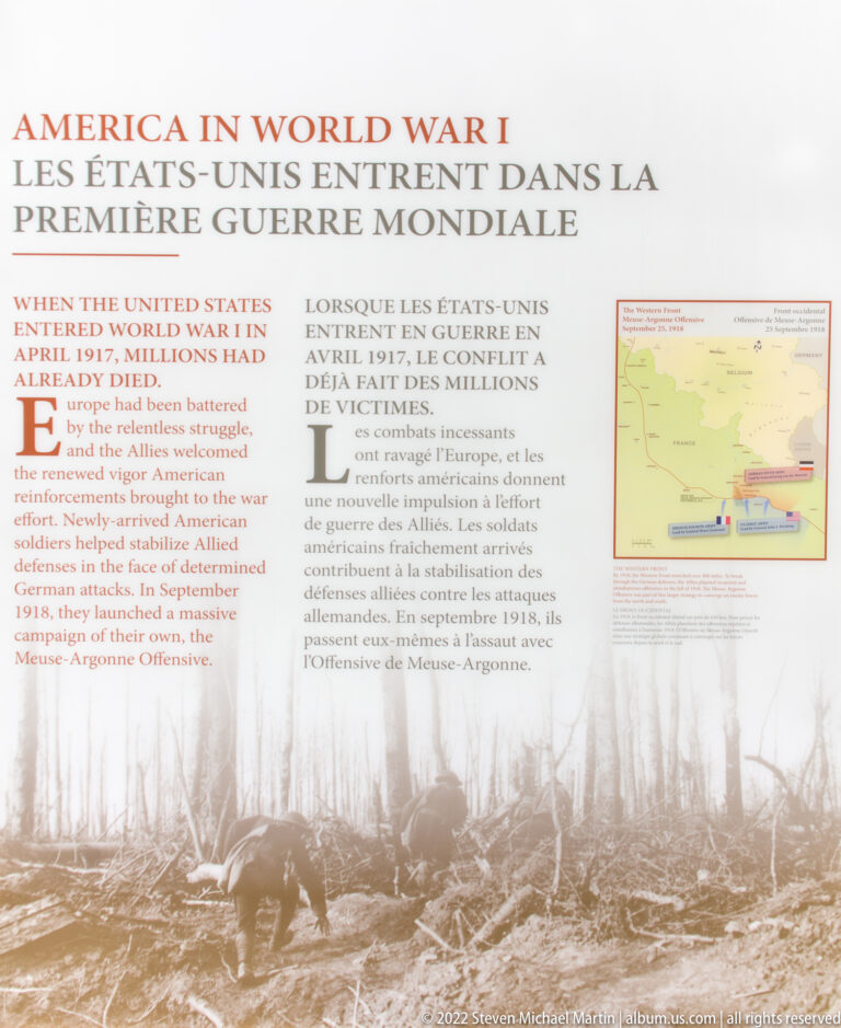 Bilingual World War I panel with text, historic photographs, and a small map about American entry into the war.