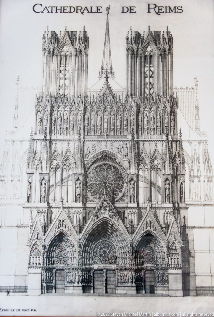 Architectural elevation drawing labeled “Cathédrale de Reims,” showing the cathedral’s twin-towered Gothic west façade.