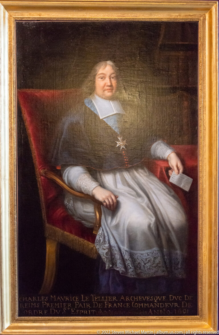 Formal painted portrait of a seated cleric in white robes and dark outer garment, holding a paper beside a red chair.