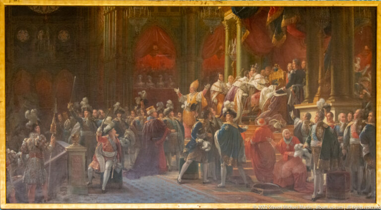 Large gathering of clergy, officials, and courtiers before a raised ceremonial platform in a grand interior.