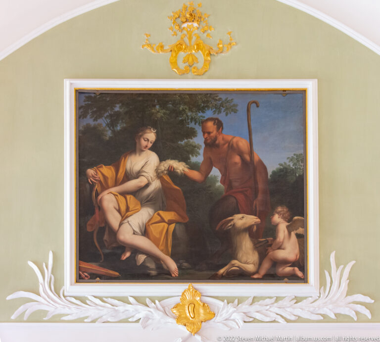 Pastoral painting of a seated woman, standing man with crook, dog, and small child beneath trees.