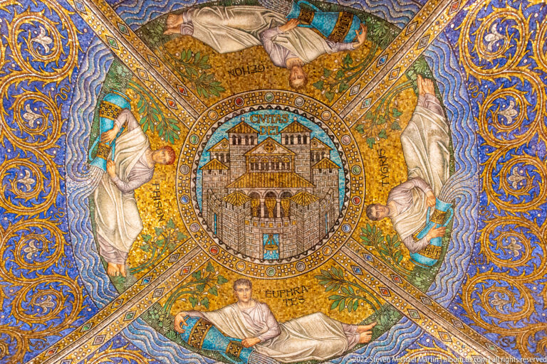 Gold and blue mosaic with a circular fortified-city emblem labeled CIVITAS DEI and surrounding figures.