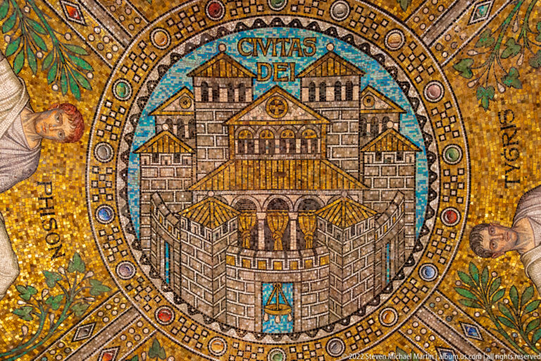 Close mosaic medallion of a stylized fortified city beneath the inscription CIVITAS DEI.