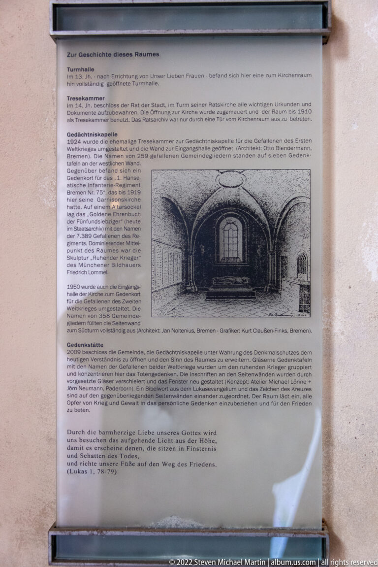 German-language interpretive panel with a historic interior illustration mounted on a church wall.