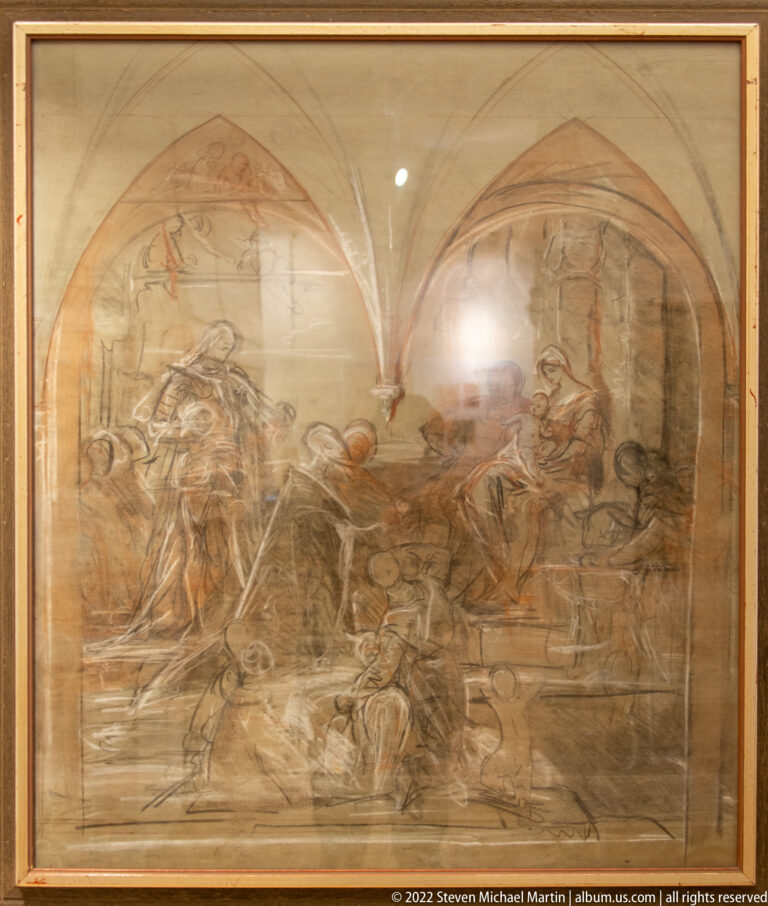 Large framed brown-and-black drawing of many figures within a vaulted architectural interior.