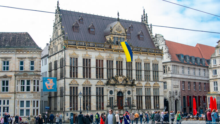 Ornate pale-stone façade of Bremen’s Schütting with steep roof, decorative gables, and tall windows.