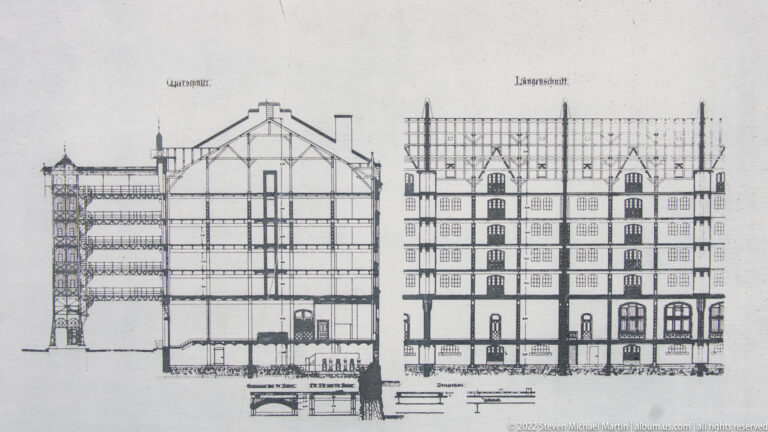 Historic architectural drawing with sectional and elevation views of a multi-story building and waterfront foundation.