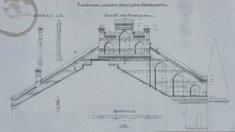 Historic engineering drawing of an arched bridge with side elevation, pier, foundations, dimensions, and German notes.