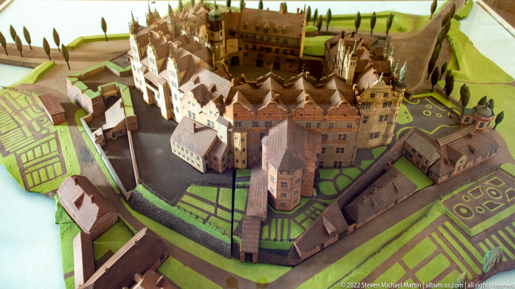 Scale model of Schwerin Castle showing clustered wings, towers, courtyards, walls, and formal gardens.
