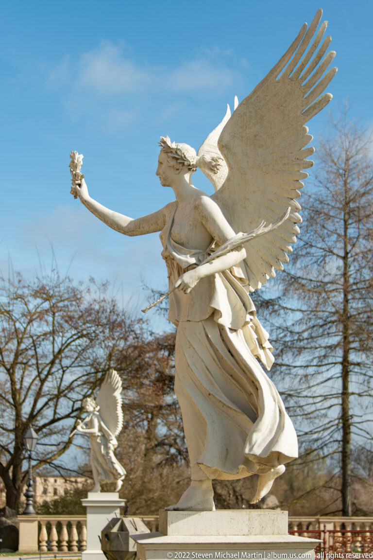 White winged Victoria extending a wreath above the Orangerie terrace at Schwerin Castle.