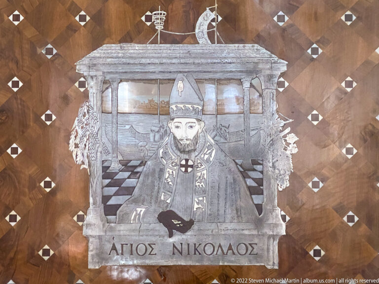 Frontal mosaic of Saint Nicholas in bishop's vestments and mitre, above the Greek inscription AGIOS NIKOLAOS.
