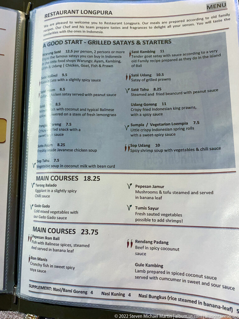 Printed Restaurant Long Pura menu listing grilled satays, main courses, prices, and Indonesian dish descriptions.