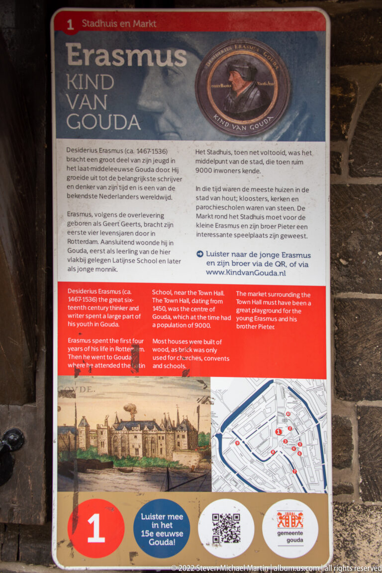 Outdoor heritage panel titled for Erasmus and Gouda, with portrait medallion, historical text, images, map, and route marker.