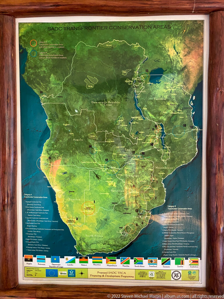 Large framed Great Limpopo Transfrontier Conservation Area map with regional terrain, borders, protected areas, and partner logos.