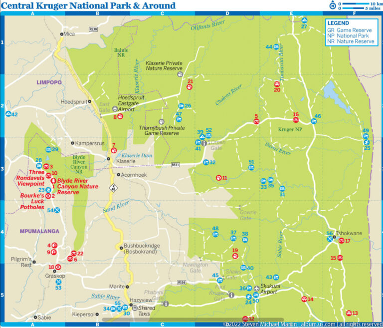 Printed map of central Kruger National Park showing roads, camps, reserves, rivers, and visitor symbols.