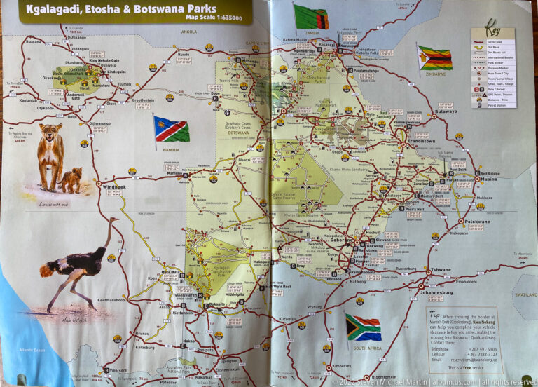 Regional southern Africa road map showing Botswana, Namibia, Zambia, Zimbabwe, South Africa, parks, roads, flags, and wildlife illustrations.