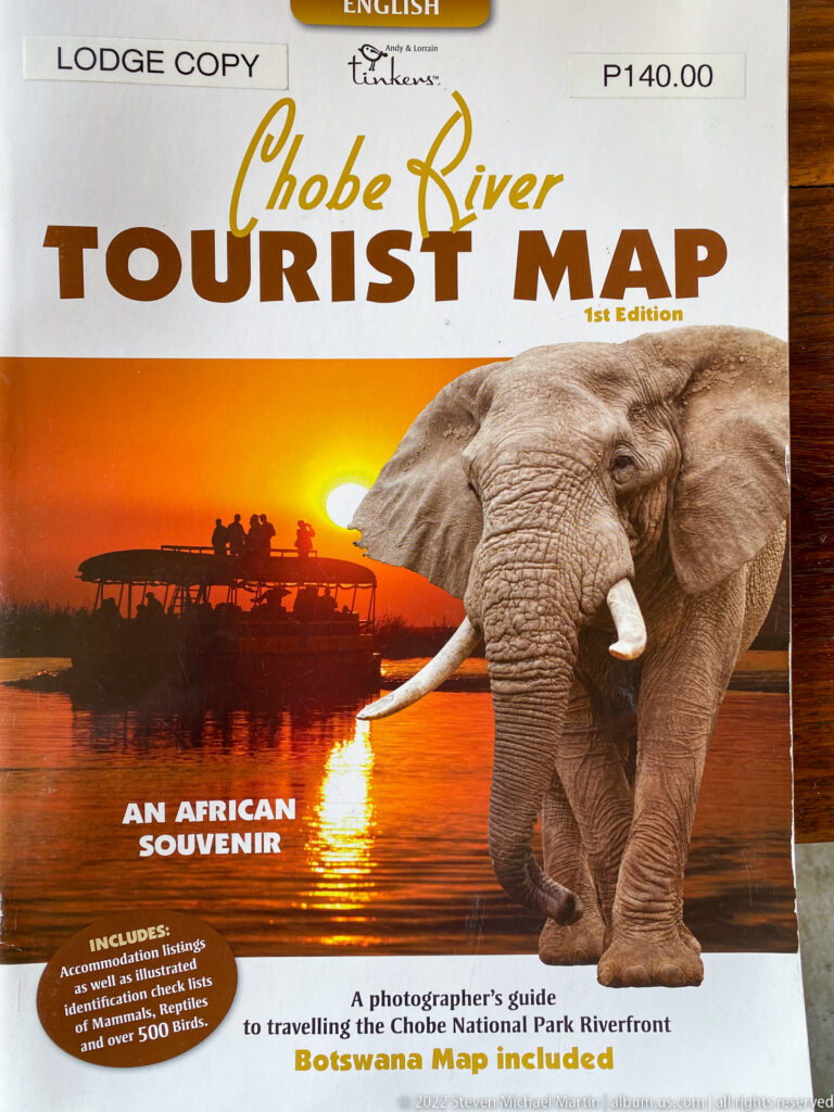 Cover of the Chobe River Tourist Map with elephant, sunset river, safari boat, and large title text.