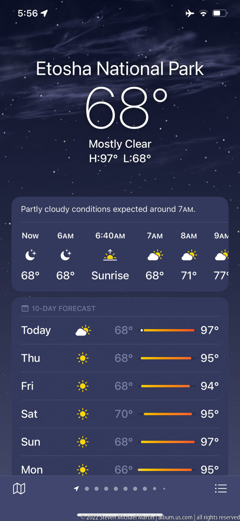 Digital screen displaying Etosha National Park weather, current conditions, sunrise information, and a multi-day forecast.