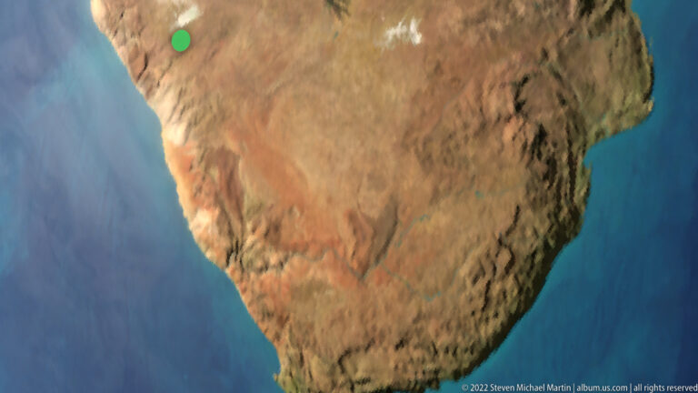 Oblique map-style view of southern Africa in ochre and brown surrounded by deep blue ocean.