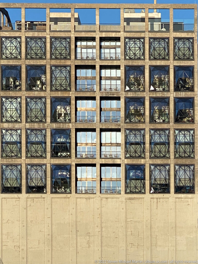 Close view of Zeitz MOCAA’s concrete grid filled with angular faceted glass windows.