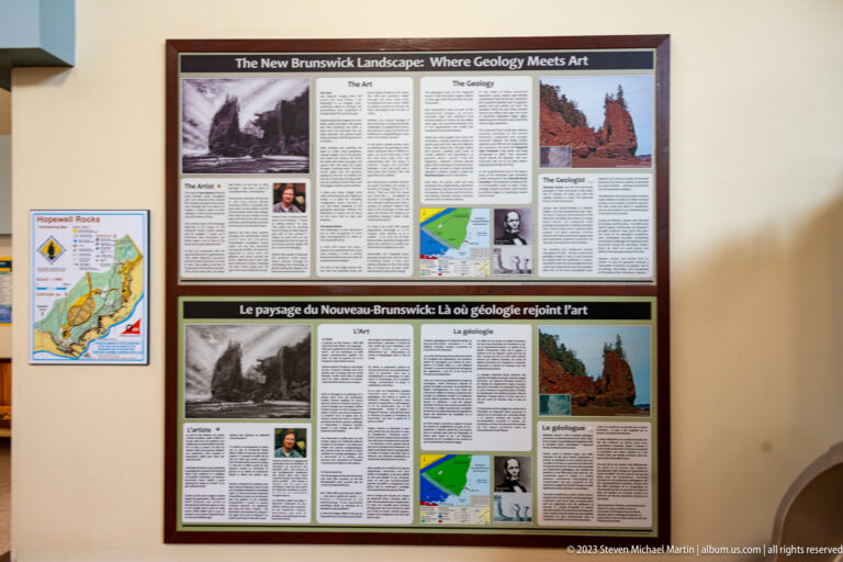 Bilingual New Brunswick Landscape: Where Geology Meets Art exhibit with maps, historic images, and coastal photographs.