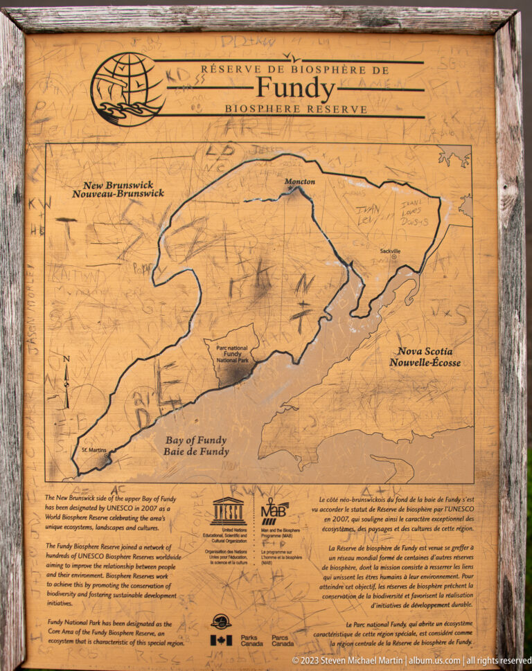 Weathered bilingual map panel labeled Fundy Biosphere Reserve, showing the Bay of Fundy and surrounding region.