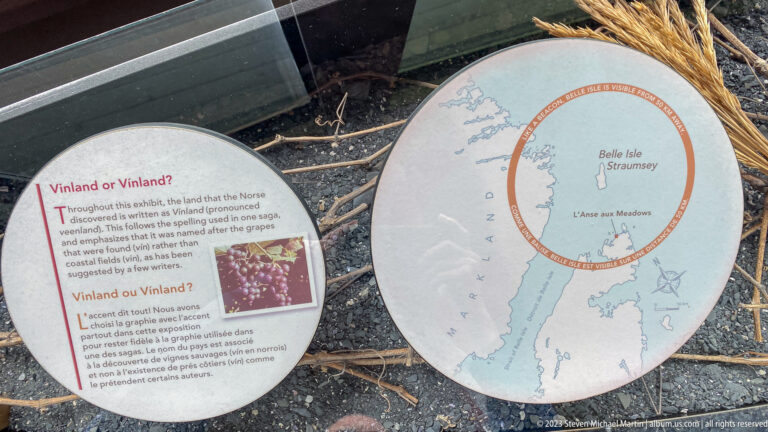 Bilingual Vinland or Vinland display beside a map of Newfoundland with a broad circle around the northern peninsula.
