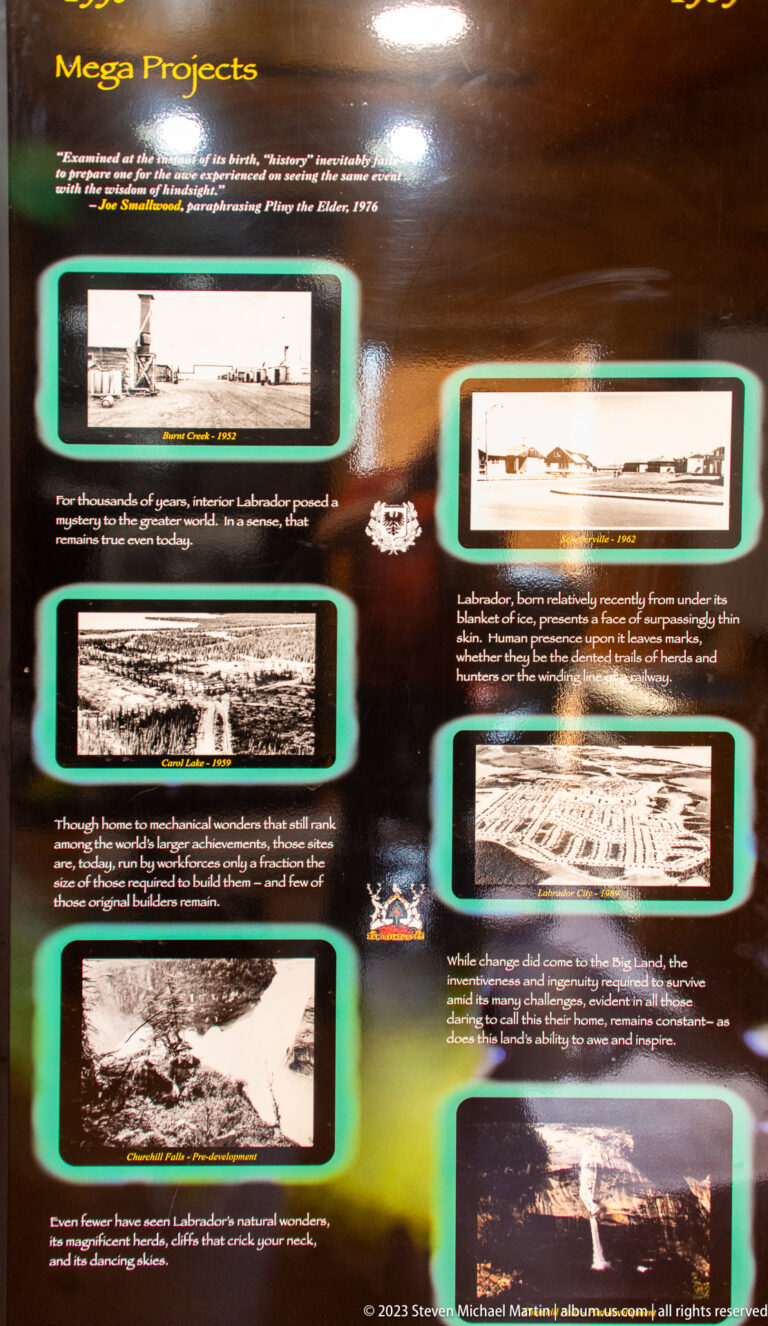 Dark interpretive panel with archival mining photographs, maps, and explanatory text arranged in several sections.