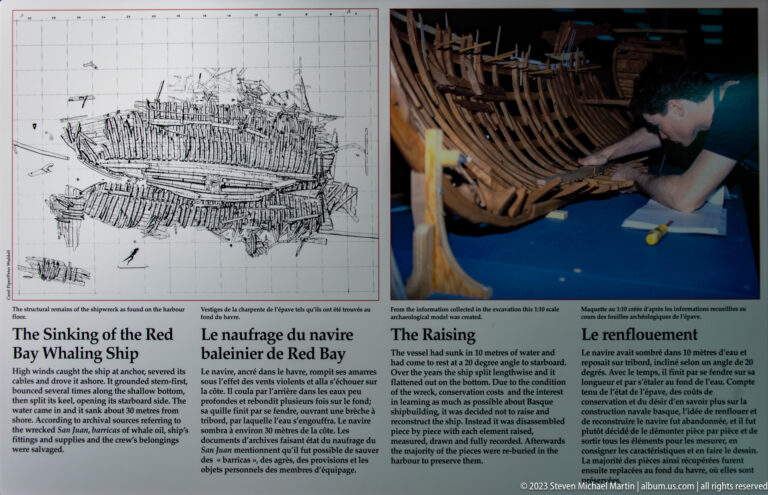 Bilingual panel on the Red Bay whaling ship sinking and raising, with wreck drawing and photograph of timber excavation.