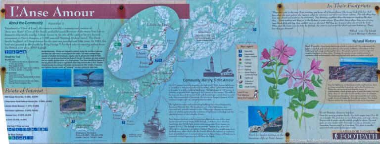 Large visitor map and interpretive board for Point Amour and the Labrador Straits with roads, communities, flowers, and wildlife notes.