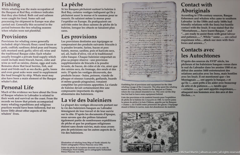 Bilingual museum panel with sections on provisions, personal life, fishing, and contact with Aboriginals, plus archival documents and an illustration.