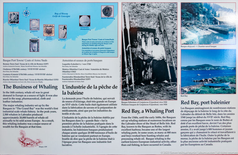 Bilingual Red Bay whaling panel with historical photographs, maps, drawings, and text on the business of whaling.