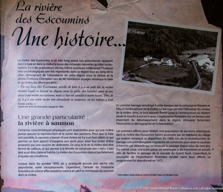 French history panel with archival photographs and text about the Escoumins River, dams, and salmon.