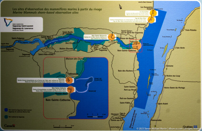 Regional map with the St. Lawrence in blue, coastal communities, roads, and numbered orange visitor markers.