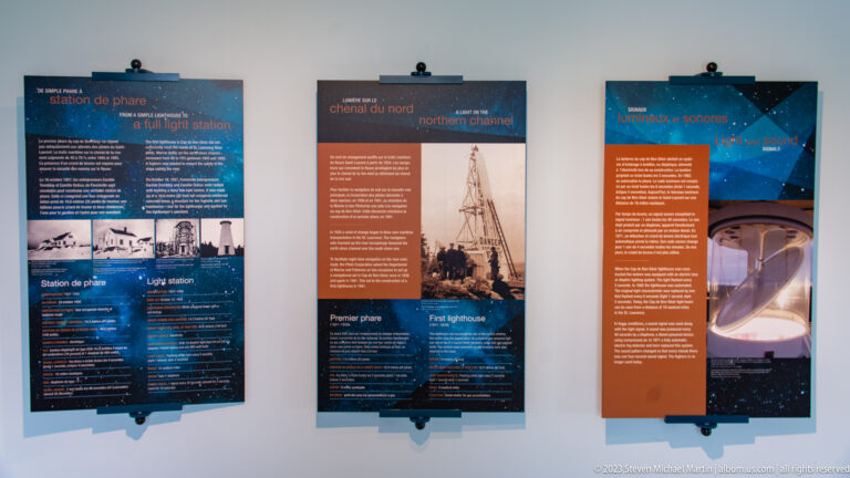 Three vertical bilingual panels with historic lighthouse photographs, channel information, and a Fresnel lens image.