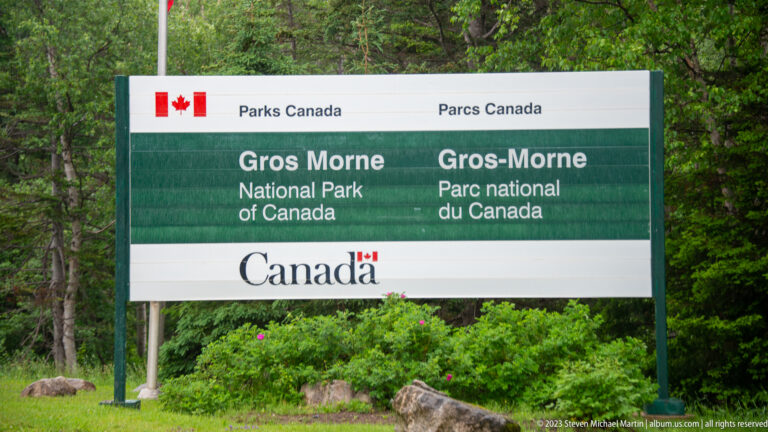Green and white Parks Canada sign reading ‘Gros Morne National Park of Canada’ in English and French.