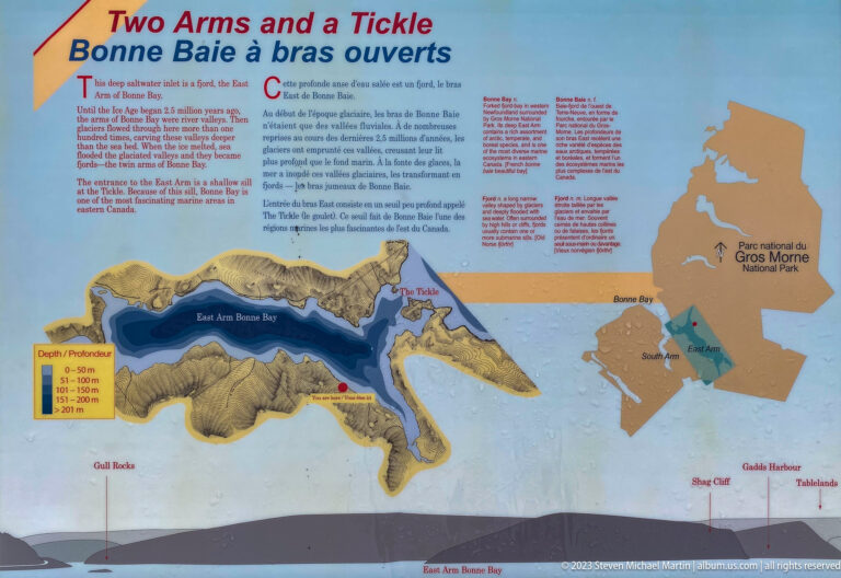 Bilingual interpretive panel with a color bathymetric map of East Arm Bonne Bay and a Gros Morne locator map.